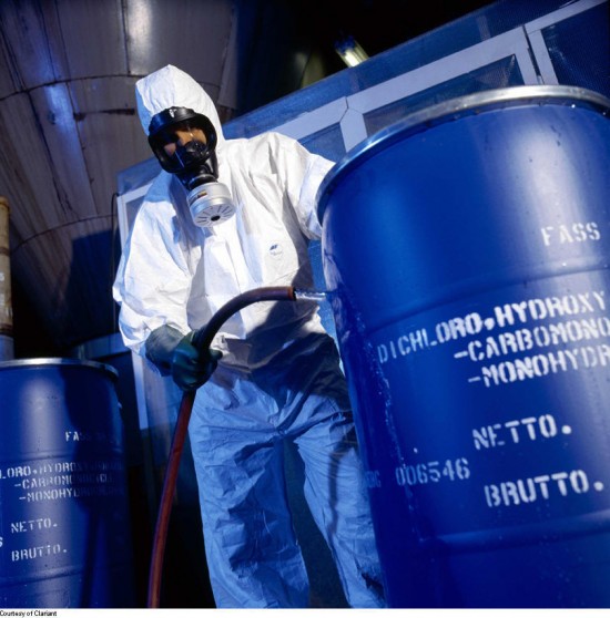 40 Hour HAZWOPER Certification is imperative for industrial waste handling HAZWOPER certified man in hazmat suit with barrel of chemicals